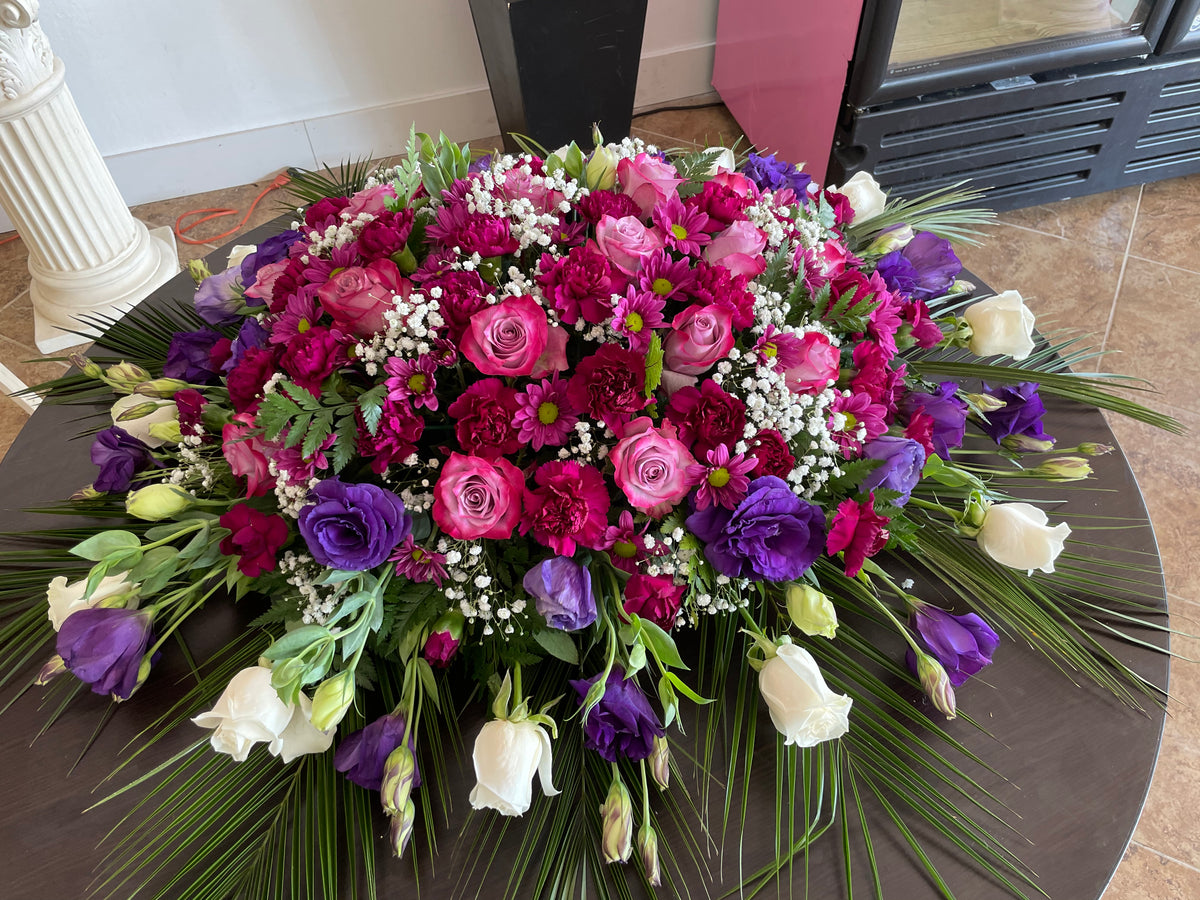 Purple Casket Spray by Bianca's Flowers